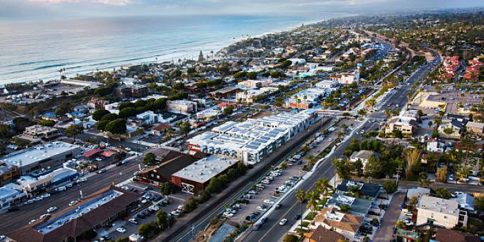 The beautiful coastal town of Encinitas, California located in northern San Diego County.  This aerial view shot from a chartered helicopter was taken during a break in a storm at dusk making for a beautiful and dramatic sky.